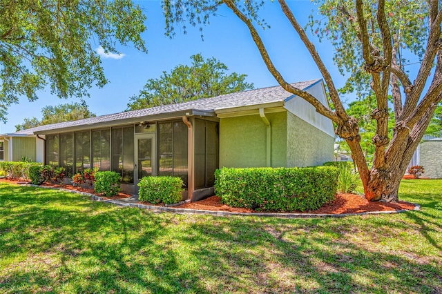 70 Cypress Pl, Oldsmar, FL 34677 - view of front of property with a sunroom, a front yard, and stucco siding