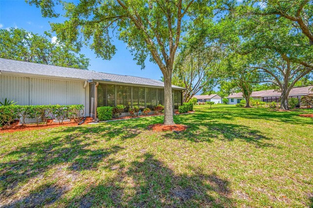70 Cypress Pl, Oldsmar, FL 34677 - view of green lawn featuring a sunroom