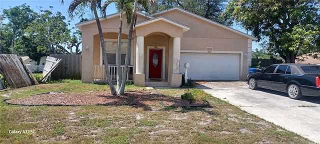 3680 19th Ave S, Saint Petersburg, FL 33711 - view of front of property featuring stucco siding, driveway, and a garage