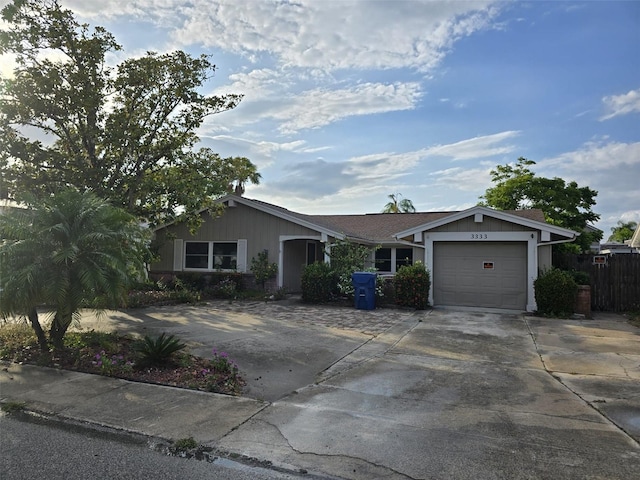 3333 Honeymoon Ln, Holiday, FL 34691 - ranch-style house featuring concrete driveway and an attached garage