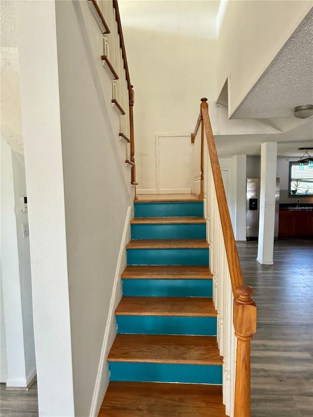 439 Corbett Rd, Lithia, FL 33547 - staircase featuring wood finished floors