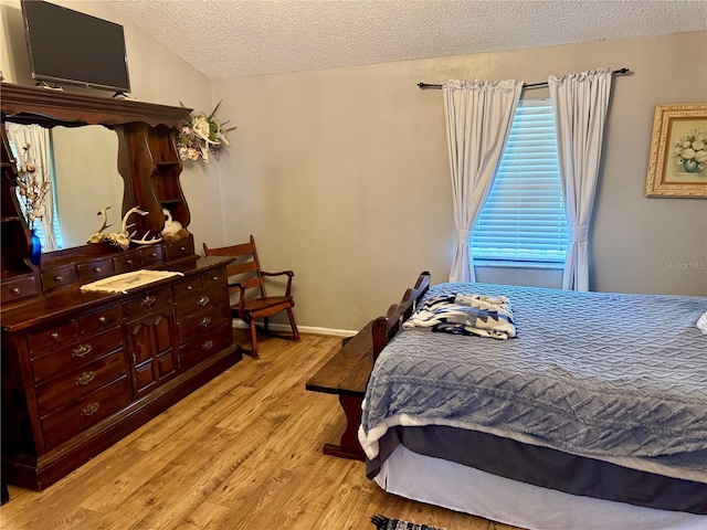 439 Corbett Rd, Lithia, FL 33547 - bedroom featuring a textured ceiling and wood finished floors