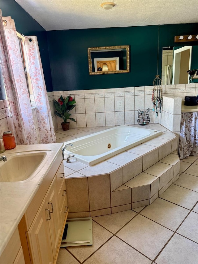 439 Corbett Rd, Lithia, FL 33547 - bathroom featuring vanity, a tub with jets, tile patterned flooring, and a textured ceiling
