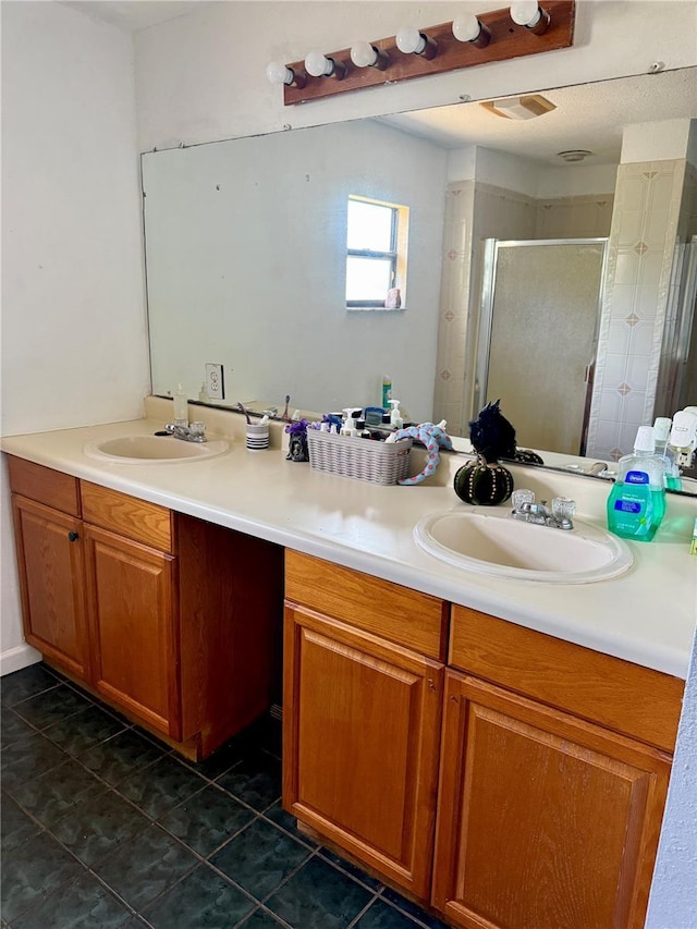 439 Corbett Rd, Lithia, FL 33547 - bathroom featuring double vanity, a shower stall, and tile patterned flooring