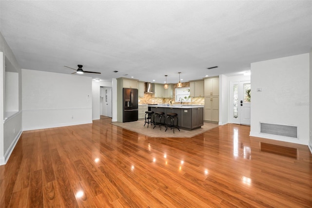 1766 Hitching Post Ln, Dunedin, FL 34698 - living room featuring light wood finished floors, ceiling fan, baseboards, and recessed lighting
