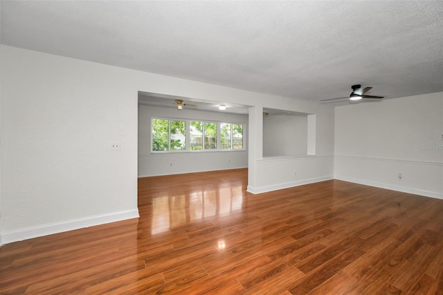 1766 Hitching Post Ln, Dunedin, FL 34698 - empty room featuring a ceiling fan, wood finished floors, and baseboards