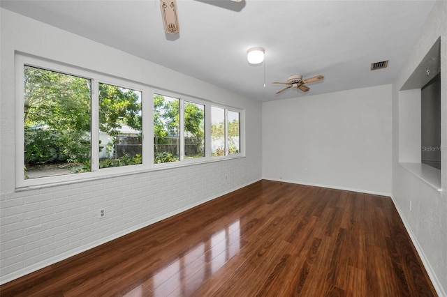 1766 Hitching Post Ln, Dunedin, FL 34698 - unfurnished room with a ceiling fan, wood finished floors, and baseboards