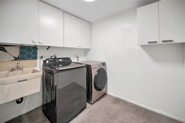 1766 Hitching Post Ln, Dunedin, FL 34698 - laundry area with cabinet space, baseboards, and washer and dryer