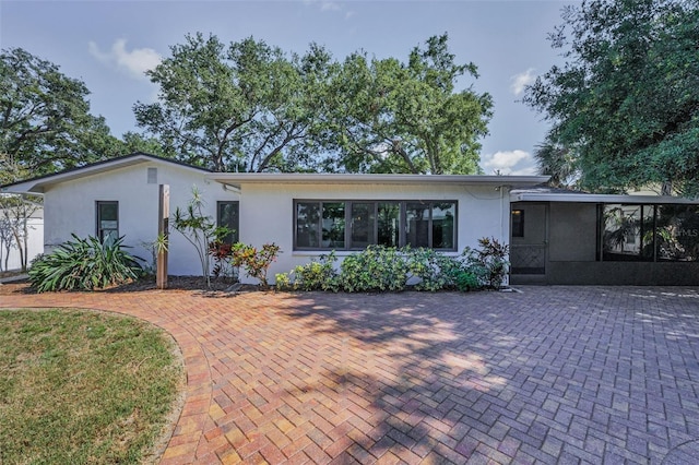 1766 Hitching Post Ln, Dunedin, FL 34698 - mid-century home featuring stucco siding