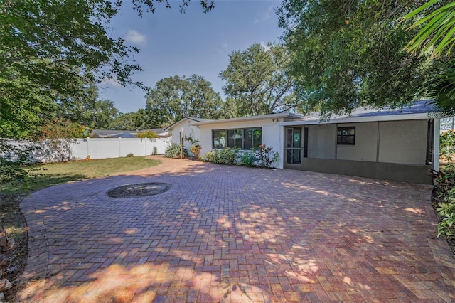 1766 Hitching Post Ln, Dunedin, FL 34698 - rear view of house featuring stucco siding