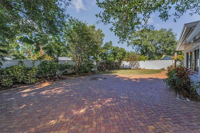 1766 Hitching Post Ln, Dunedin, FL 34698 - fenced backyard featuring a patio area
