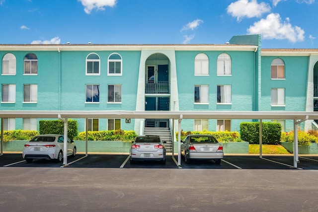 255 114th Ave N Unit 4, Saint Petersburg, FL 33716 - view of property with covered parking