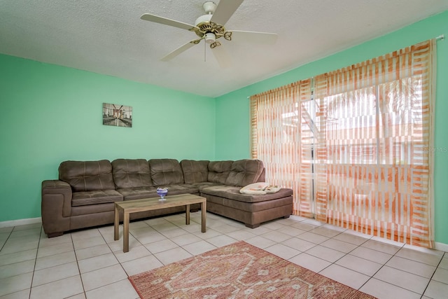 255 114th Ave N Unit 4, Saint Petersburg, FL 33716 - living area featuring ceiling fan, tile patterned floors, baseboards, and a textured ceiling
