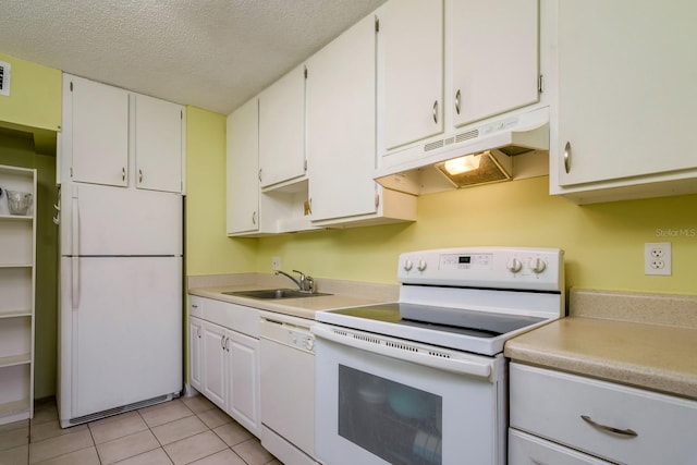 255 114th Ave N Unit 4, Saint Petersburg, FL 33716 - kitchen with white appliances, under cabinet range hood, a sink, light countertops, and a textured ceiling