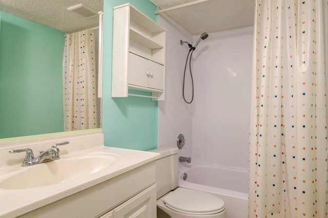 255 114th Ave N Unit 4, Saint Petersburg, FL 33716 - full bathroom featuring vanity, shower / bath combo, toilet, and a textured ceiling