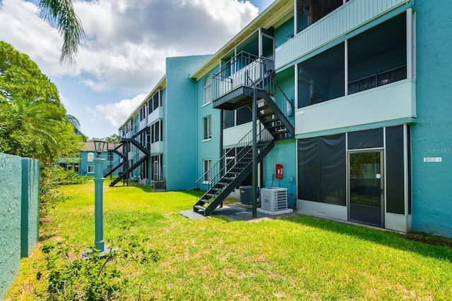 255 114th Ave N Unit 4, Saint Petersburg, FL 33716 - view of apartment building / complex featuring stairs and central air condition unit