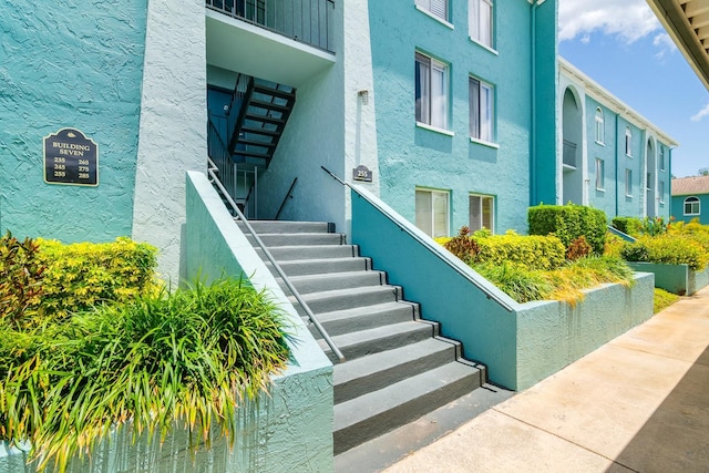 255 114th Ave N Unit 4, Saint Petersburg, FL 33716 - doorway to property with stucco siding