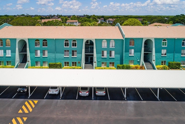 255 114th Ave N Unit 4, Saint Petersburg, FL 33716 - view of property featuring uncovered parking