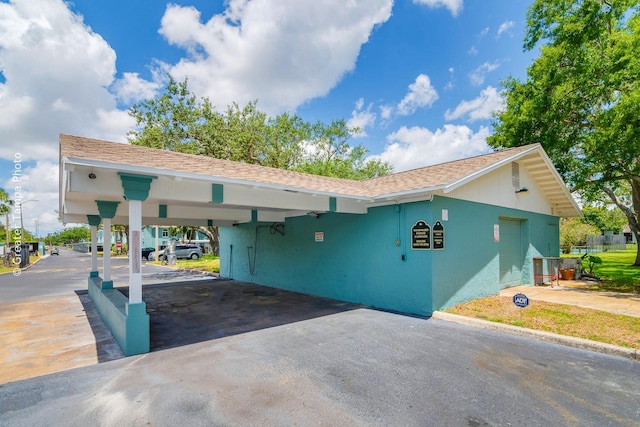 255 114th Ave N Unit 4, Saint Petersburg, FL 33716 - view of property featuring driveway and a carport
