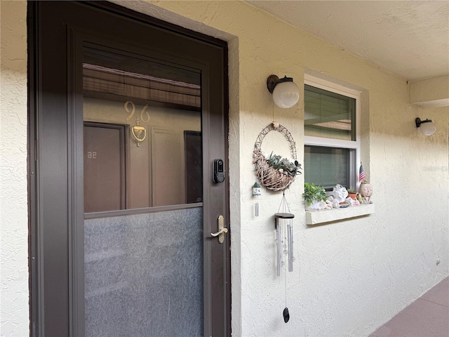 1100 E Bay Dr Unit 96, Largo, FL 33770 - doorway to property featuring stucco siding
