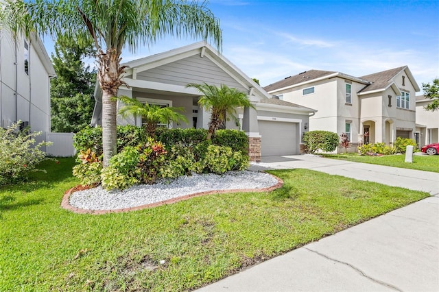 7725 Tangle Rush Dr, Gibsonton, FL 33534 - view of front facade with concrete driveway, a garage, and stucco siding