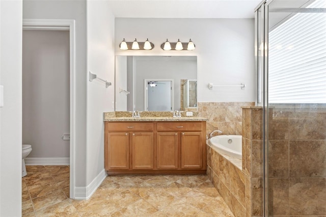 7725 Tangle Rush Dr, Gibsonton, FL 33534 - full bath featuring a bath, double vanity, a stall shower, toilet, and tile patterned flooring