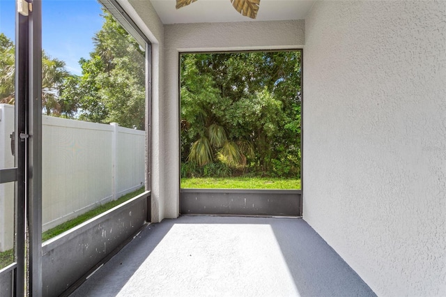 7725 Tangle Rush Dr, Gibsonton, FL 33534 - unfurnished sunroom with a ceiling fan