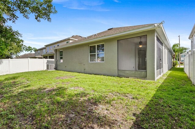 7725 Tangle Rush Dr, Gibsonton, FL 33534 - rear view of house featuring stucco siding and a ceiling fan