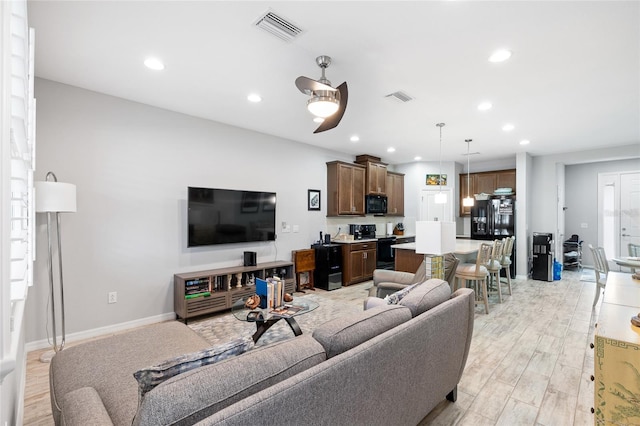 12353 Bayou Flats Ln, Tampa, FL 33635 - living room with recessed lighting, a ceiling fan, light wood-style flooring, and baseboards