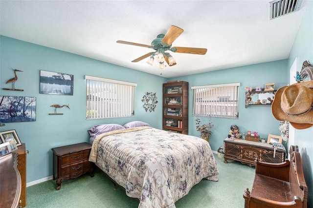 10400 112th Way, Largo, FL 33778 - carpeted bedroom with ceiling fan and baseboards