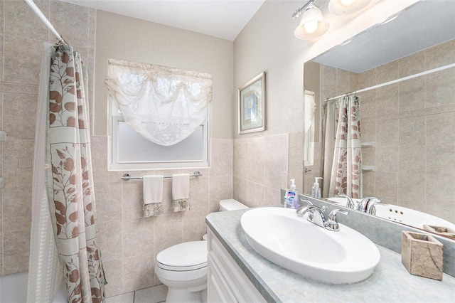 10400 112th Way, Largo, FL 33778 - bathroom with tile walls, vanity, toilet, shower / bath combo, and tile patterned flooring