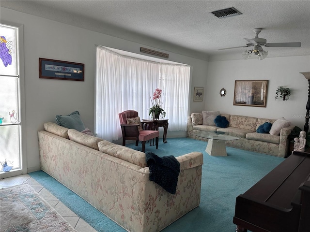 10400 112th Way, Largo, FL 33778 - carpeted living area with a textured ceiling and a ceiling fan