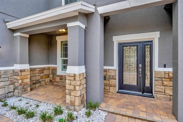 1229 Hillandale Reserve Dr, Tampa, FL 33613 - view of exterior entry featuring stone siding and stucco siding