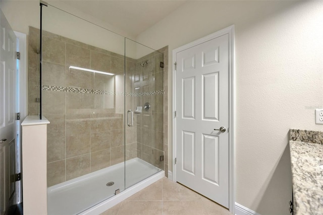 1229 Hillandale Reserve Dr, Tampa, FL 33613 - bathroom featuring a shower stall, tile patterned floors, and vanity