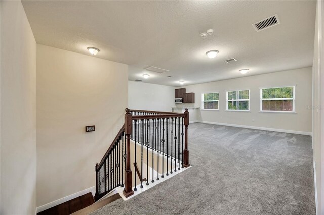 1229 Hillandale Reserve Dr, Tampa, FL 33613 - hall with an upstairs landing, carpet, and attic access