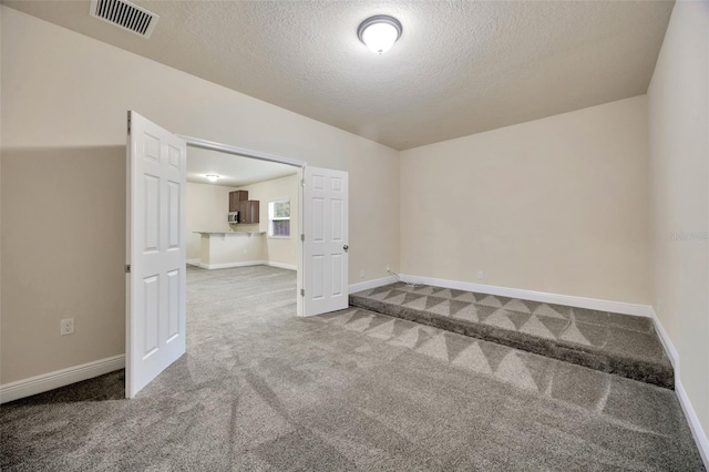 1229 Hillandale Reserve Dr, Tampa, FL 33613 - empty room with a textured ceiling and carpet floors