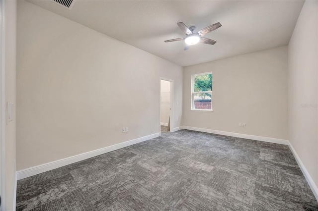 1229 Hillandale Reserve Dr, Tampa, FL 33613 - empty room featuring a ceiling fan and dark carpet