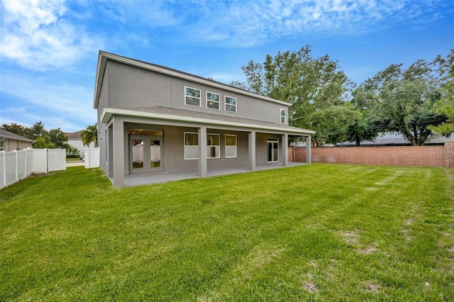 1229 Hillandale Reserve Dr, Tampa, FL 33613 - back of property with stucco siding, a fenced backyard, and a patio area