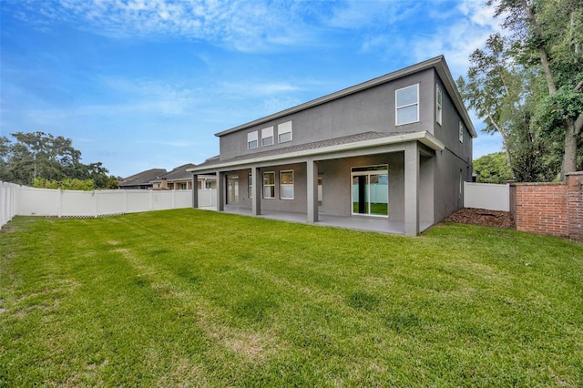 1229 Hillandale Reserve Dr, Tampa, FL 33613 - back of house featuring stucco siding, a patio, and a fenced backyard