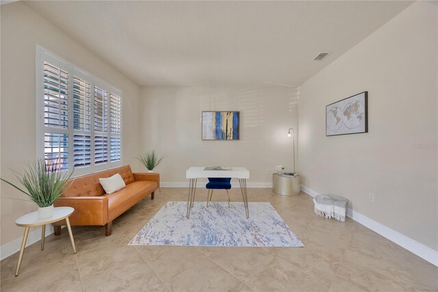 1229 Hillandale Reserve Dr, Tampa, FL 33613 - living area featuring tile patterned floors and baseboards