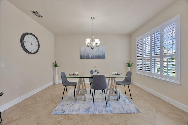 1229 Hillandale Reserve Dr, Tampa, FL 33613 - tiled dining room featuring a chandelier and baseboards