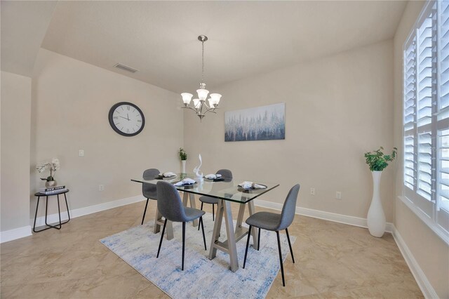 1229 Hillandale Reserve Dr, Tampa, FL 33613 - dining area featuring a chandelier and baseboards
