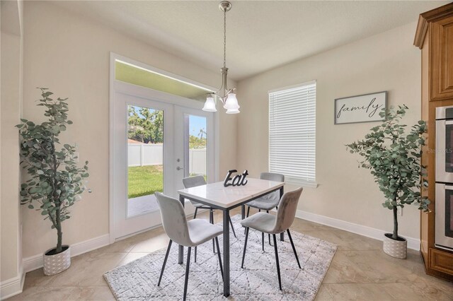 1229 Hillandale Reserve Dr, Tampa, FL 33613 - dining room featuring a chandelier and light tile patterned flooring