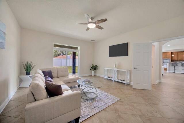 1229 Hillandale Reserve Dr, Tampa, FL 33613 - living area featuring ceiling fan and arched walkways