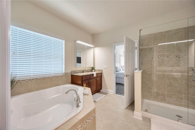 1229 Hillandale Reserve Dr, Tampa, FL 33613 - bathroom with a garden tub, vanity, tile patterned flooring, a stall shower, and connected bathroom