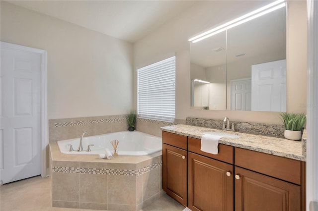 1229 Hillandale Reserve Dr, Tampa, FL 33613 - bathroom featuring vanity, a garden tub, and tile patterned floors