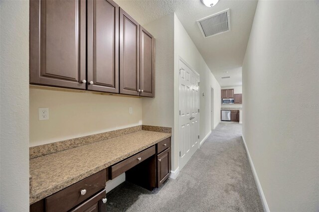 1229 Hillandale Reserve Dr, Tampa, FL 33613 - corridor featuring light colored carpet and a desk