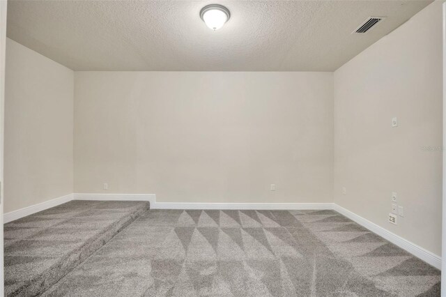 1229 Hillandale Reserve Dr, Tampa, FL 33613 - unfurnished room featuring a textured ceiling and carpet