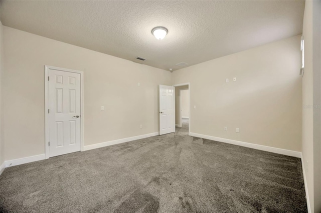 1229 Hillandale Reserve Dr, Tampa, FL 33613 - carpeted empty room with a textured ceiling and baseboards