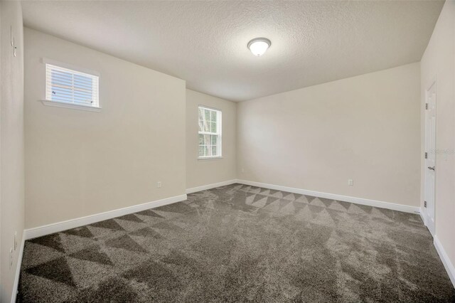 1229 Hillandale Reserve Dr, Tampa, FL 33613 - carpeted empty room with baseboards and a textured ceiling